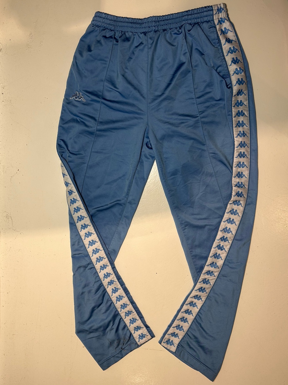 Kappa Light Blue Track Pants with White Logo Tape